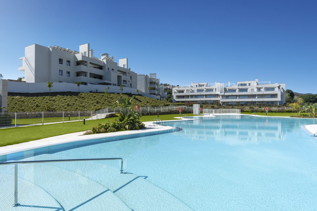 The large communal swimming pool is a perfect oasis for relaxing under the warm Spanish sun.
