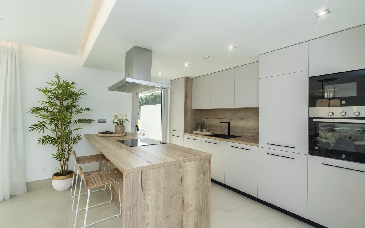 The modern kitchen is fully equipped with high-quality appliances and designed for both function and socialising.