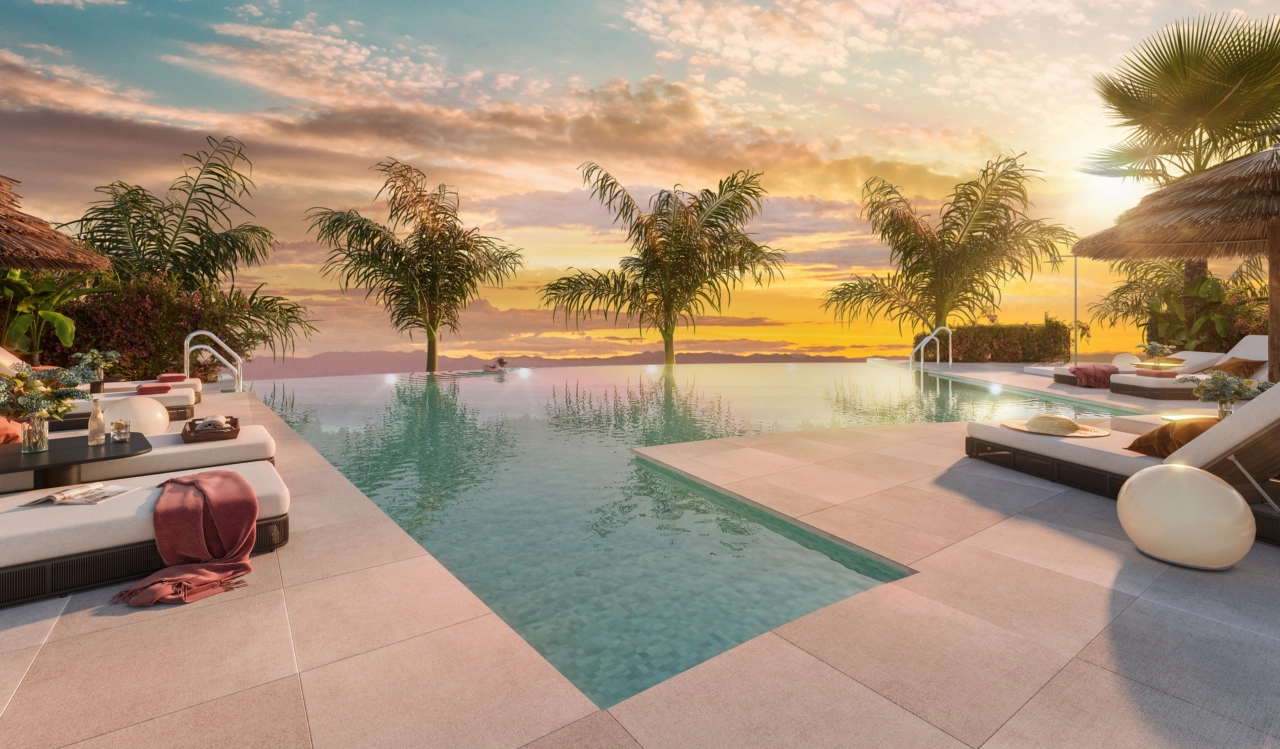 The communal infinity pool offers a breathtaking sunset view over the Costa del Sol.