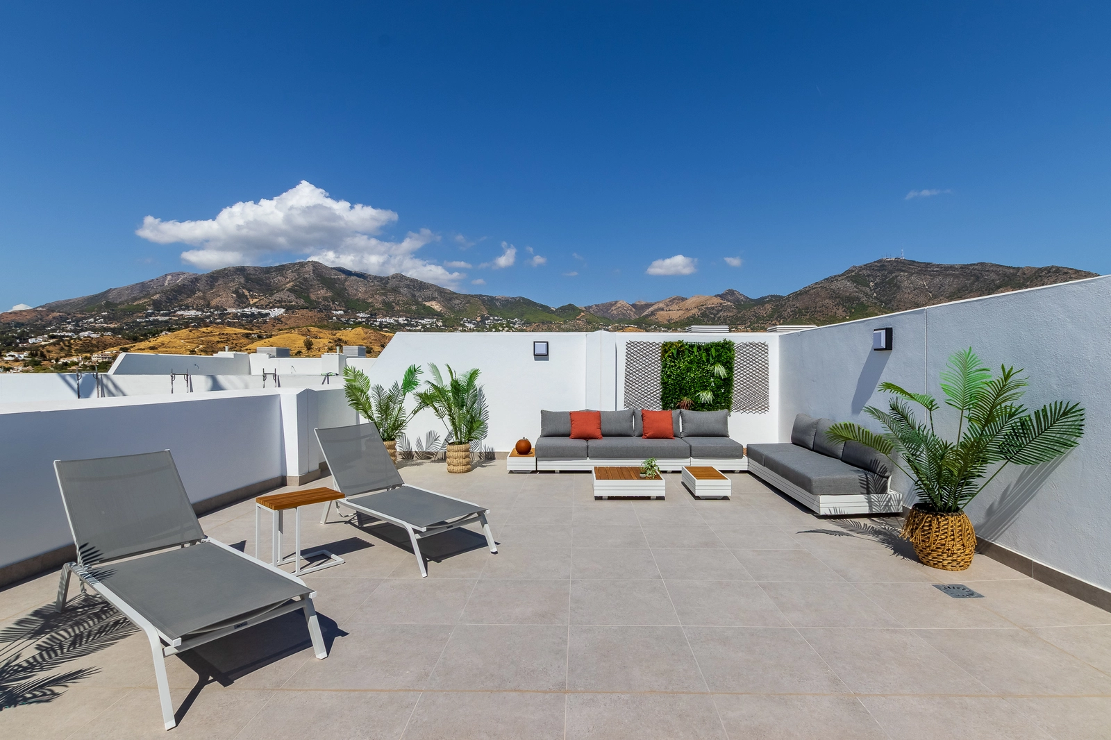 A spacious rooftop solarium, the perfect private space for sunbathing, entertaining, and enjoying the wonderful mountain views.