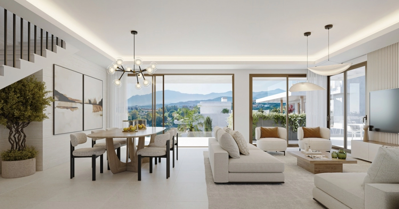 The bright, open-plan living area is designed for comfort, with expansive windows framing mountain views.