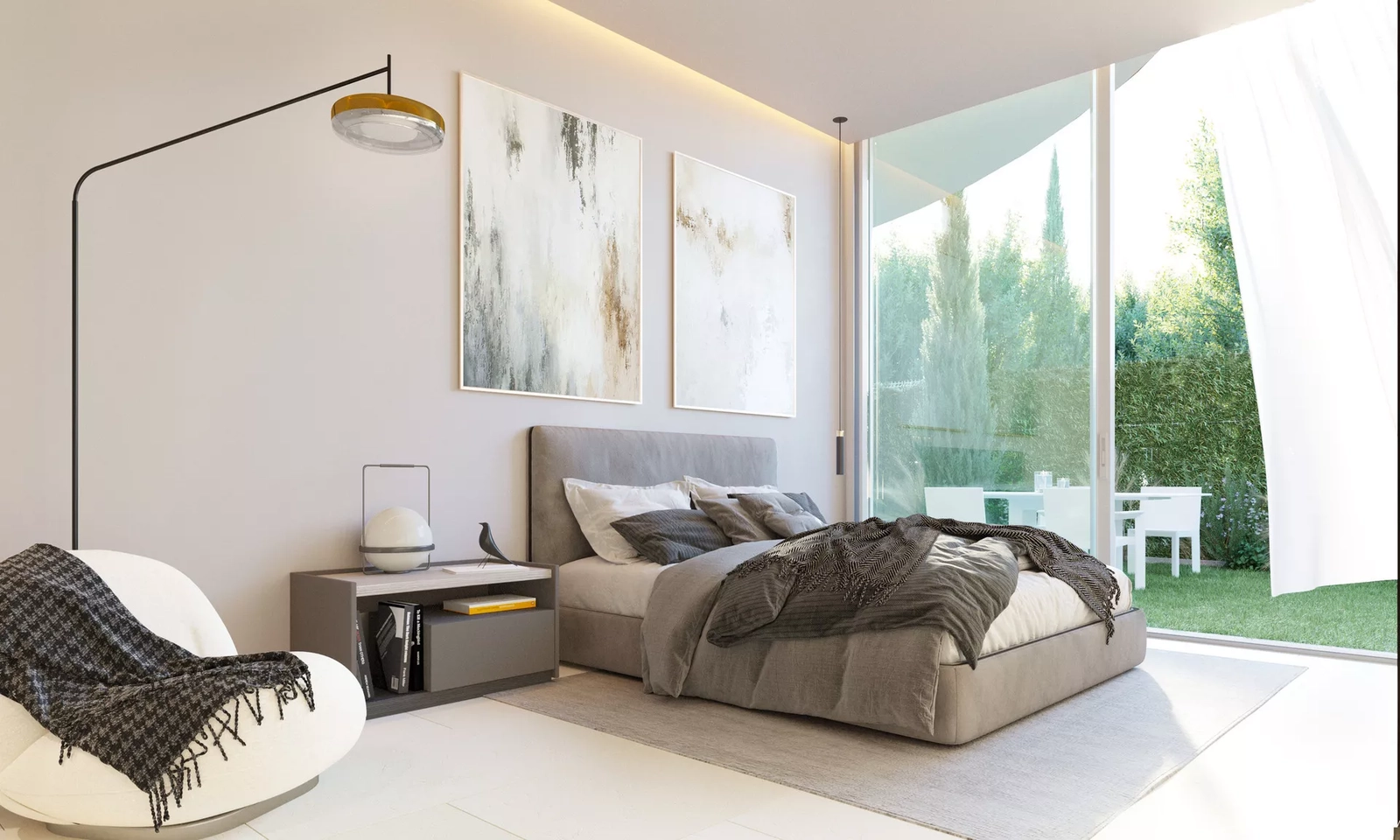 A comfortable bedroom with large sliding glass doors that open directly onto the Mediterranean garden.