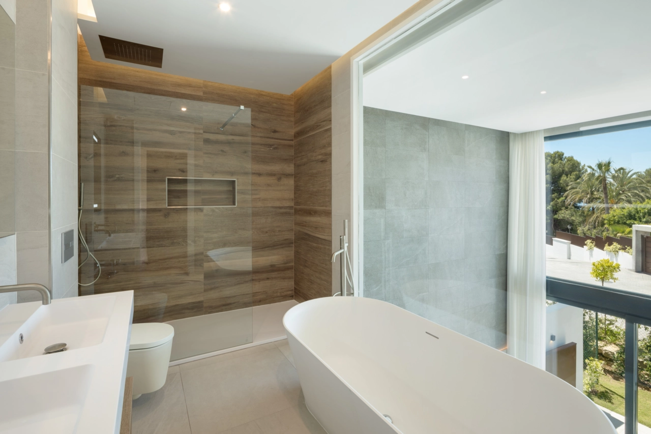 Contemporary bathroom design that combines natural materials and abundant light to create a tranquil space.