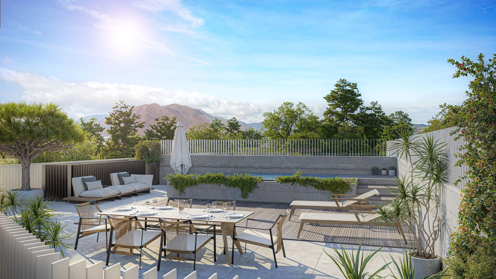 The rooftop terraces offer a perfect private space for relaxation and entertaining, with stunning mountain and sea views.