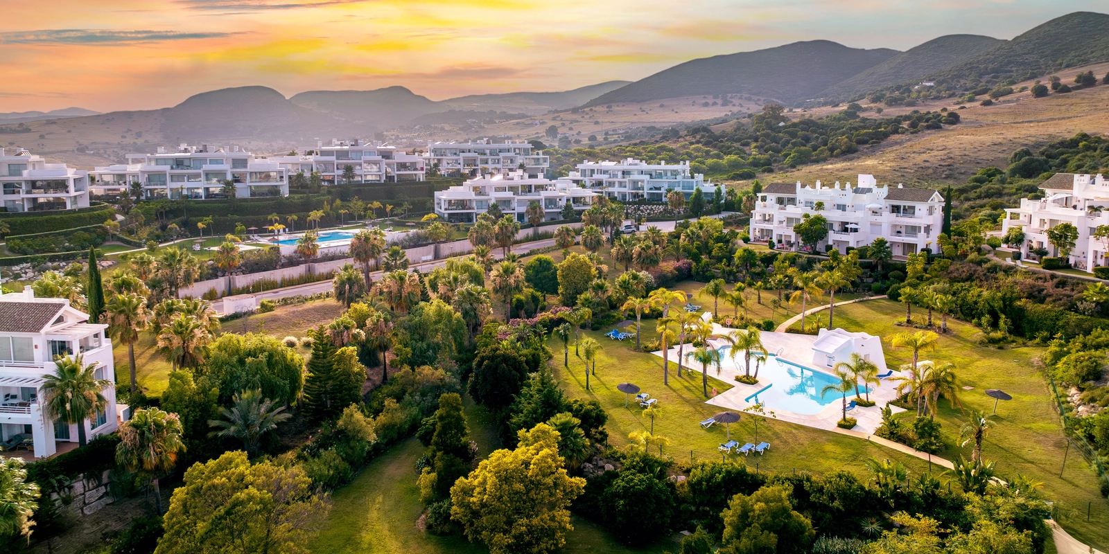 An aerial view of this stunning development, nestled in the green hills of the Costa del Sol.