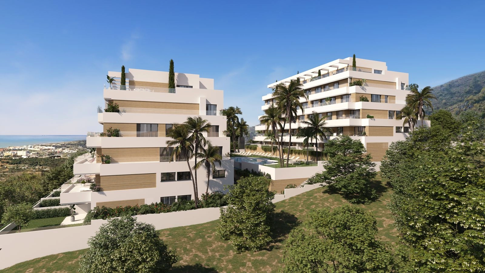 An elevated view of the modern residential complex, showcasing its stunning architecture and views towards the Mediterranean Sea.