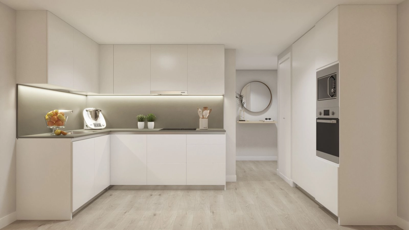 The modern, open-plan kitchen is fully equipped and designed with clean lines and high-quality finishes.