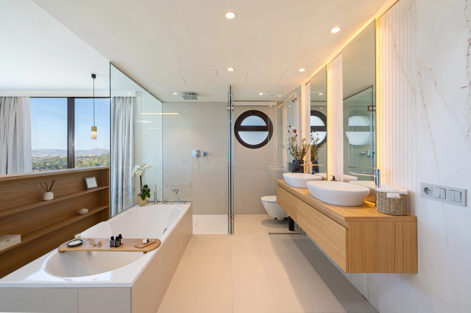 A spacious and modern bathroom design, combining natural wood tones with sleek, contemporary finishes.