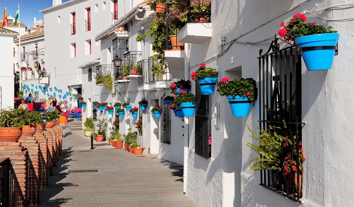 The charming streets of Mijas Pueblo, a traditional Andalusian white village just a short drive away.