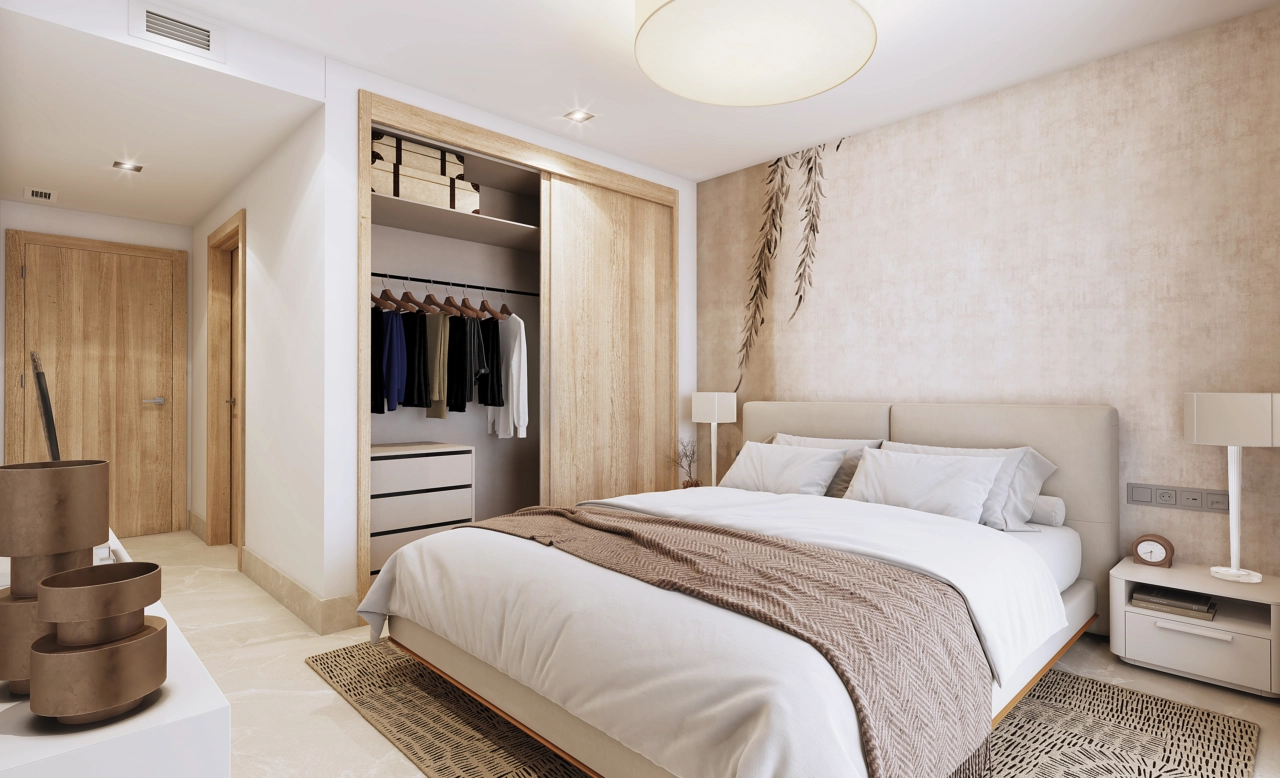 A serene and comfortable master bedroom, complete with fitted wardrobes and a warm, contemporary design.