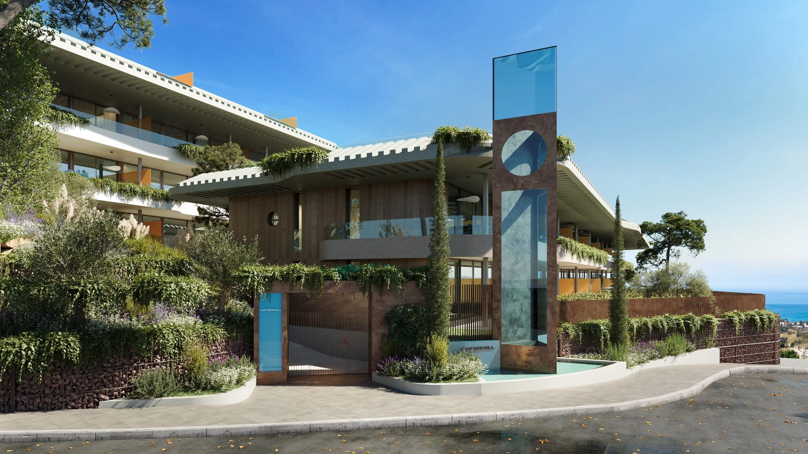 The impressive and welcoming entrance to Waterfall Residences, where contemporary design meets natural elements.