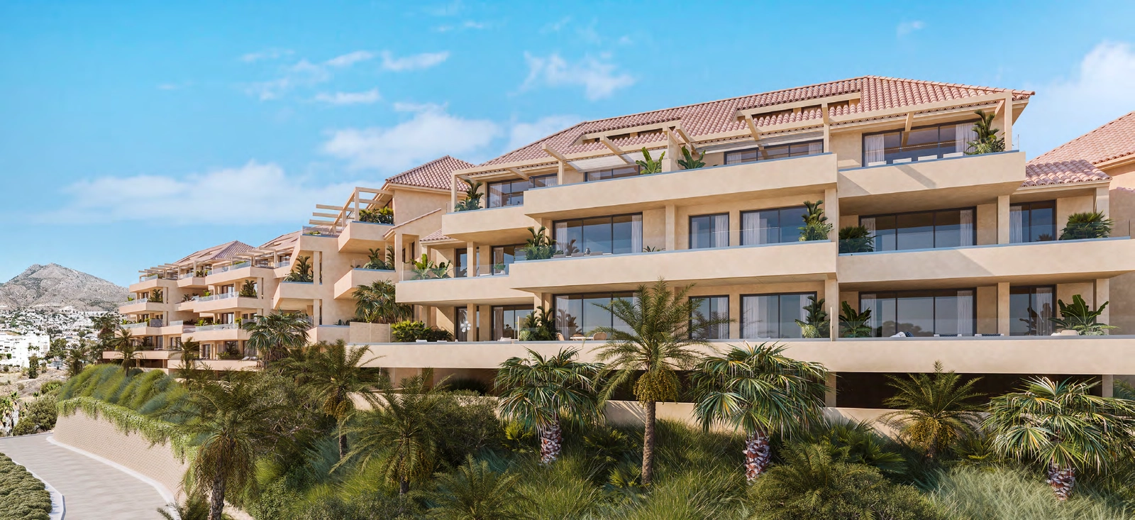 La elegante arquitectura de la urbanización, integrada cuidadosamente en el paisaje natural de la ladera.