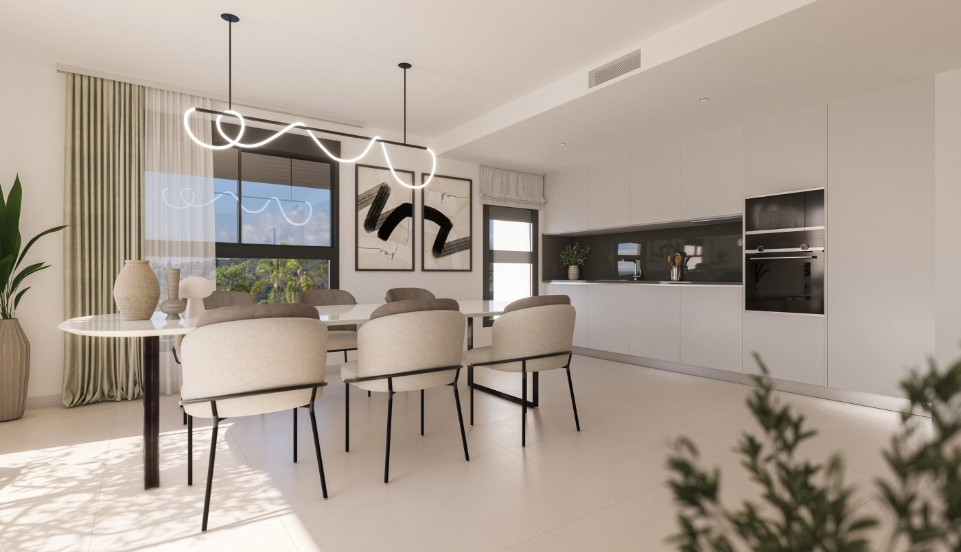Una cocina y zona de comedor elegantes y modernas, ideales para recibir a amigos y familiares.