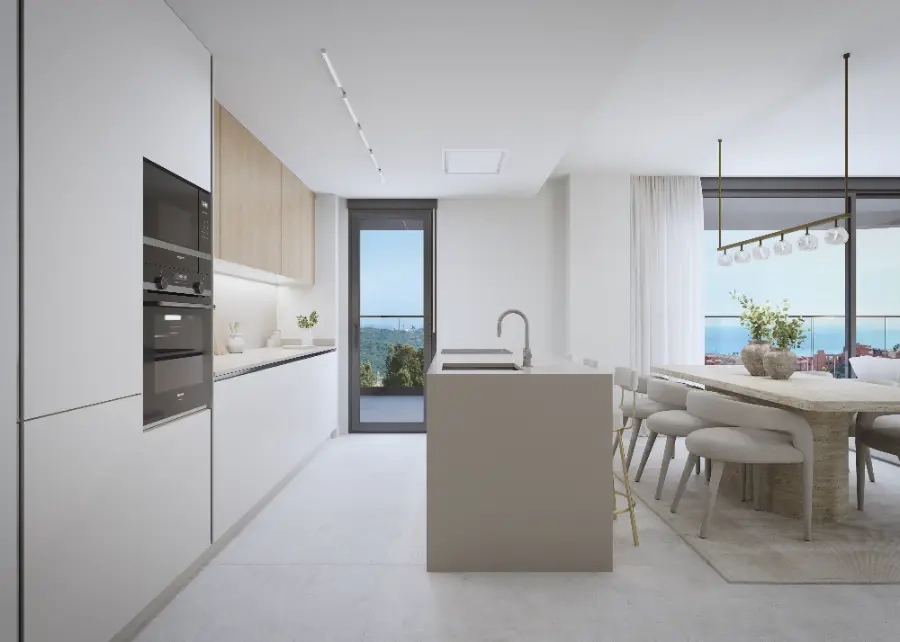 Una cocina moderna y totalmente equipada que se integra con la zona de salón, perfecta para el ocio.