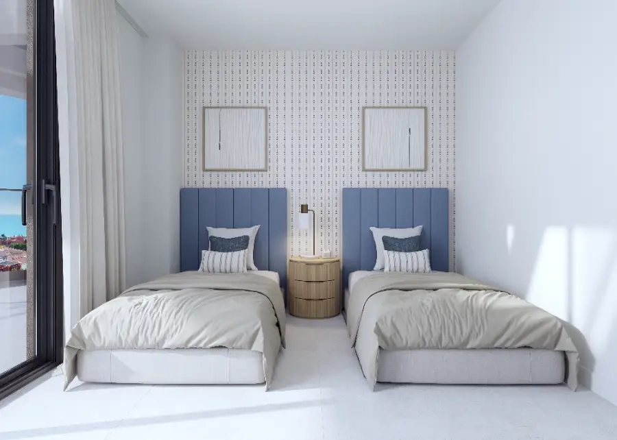 Un cómodo y luminoso dormitorio de invitados, que ofrece un espacio acogedor para familiares y amigos.