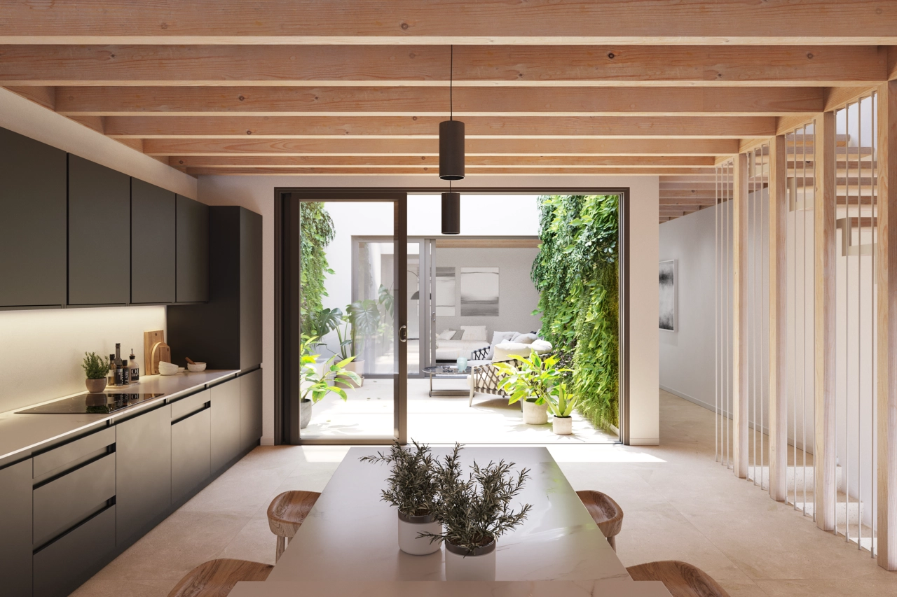 La cocina moderna está diseñada para la funcionalidad y se abre al patio central.