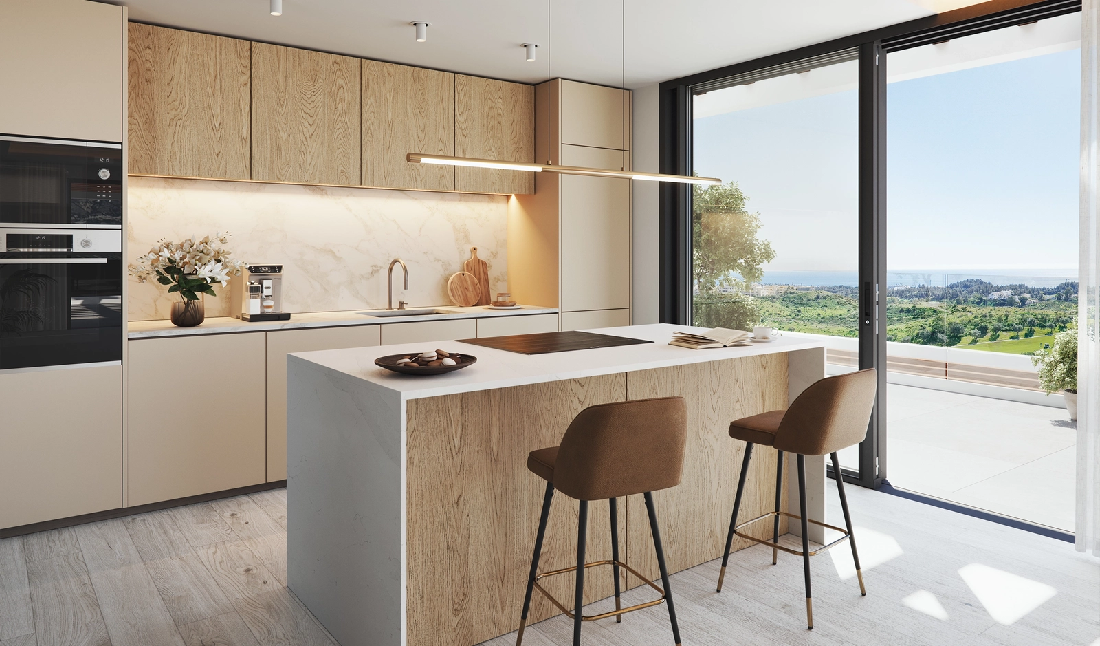 Et moderne kjøkken med hvitevarer av topp kvalitet og åpen utsikt over Mijas og det omkringliggende landskapet.